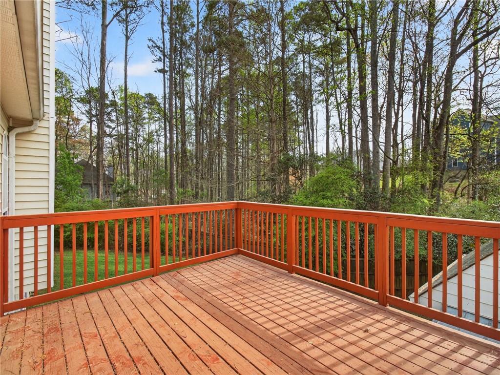 2038 Buford Dam Road Buford, GA 30518 - Photo 50 of 56 a view of balcony with wooden floor and fence