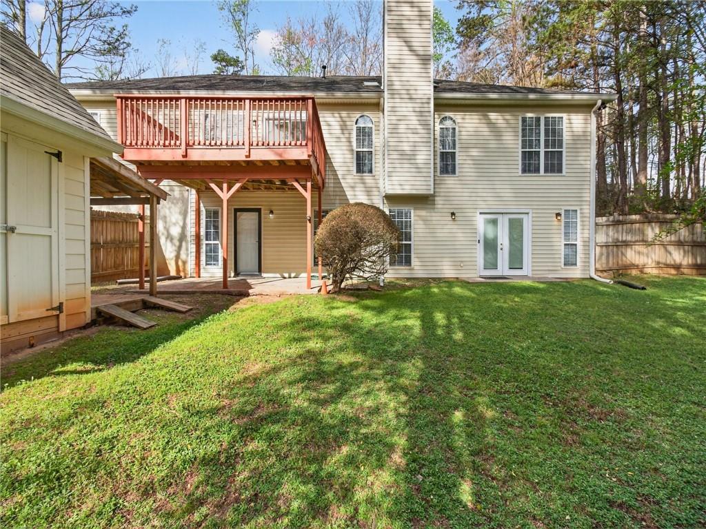 2038 Buford Dam Road Buford, GA 30518 - Photo 55 of 56 a front view of a house with garden