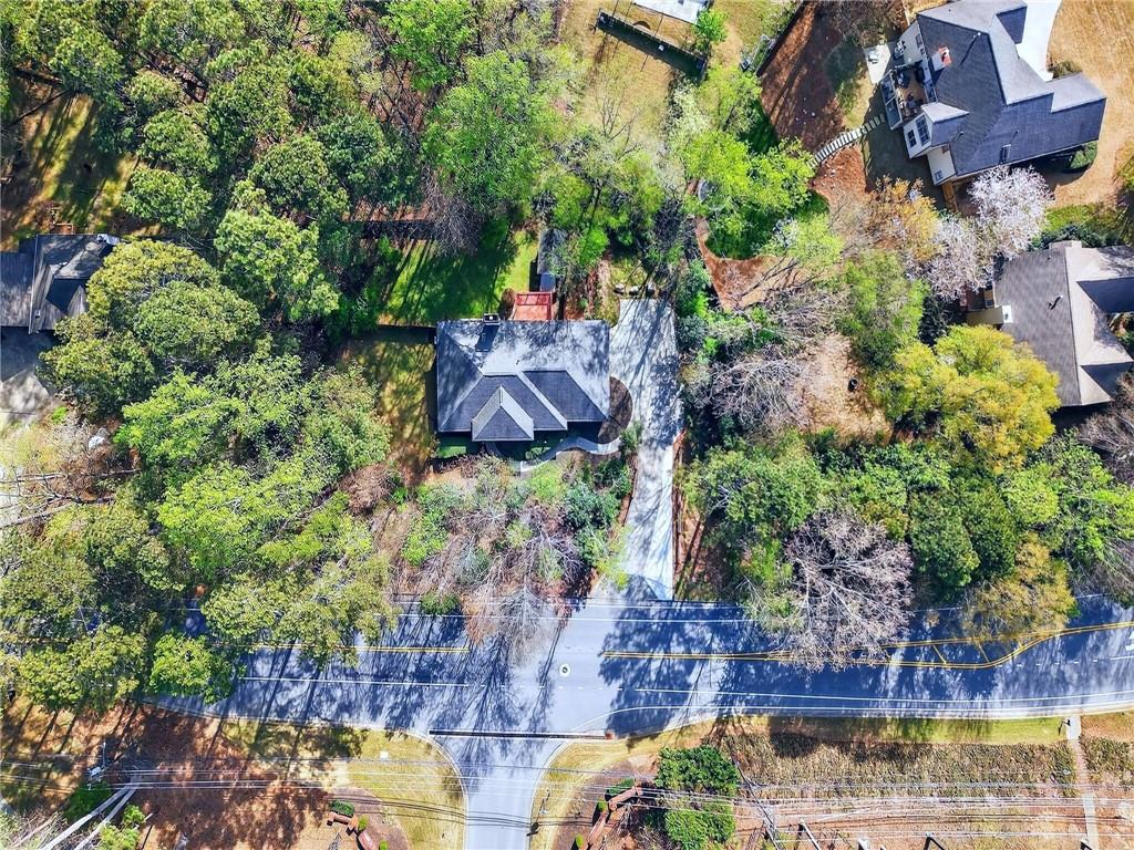 2038 Buford Dam Road Buford, GA 30518 - Photo 7 of 56 a view of a garden with a bench