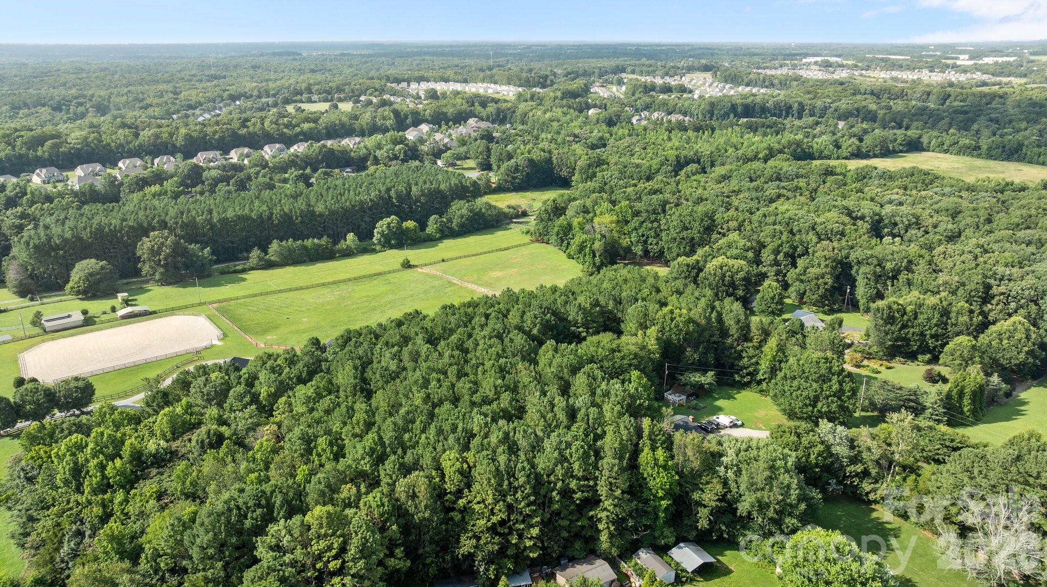 1108 Willoughby Road Monroe, NC 28110 - Photo 44 of 48 an aerial view of residential houses with outdoor space and trees