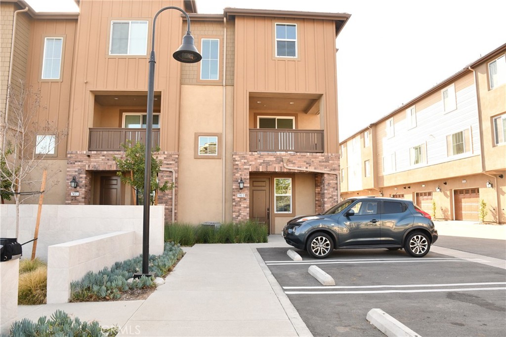 a view of a car parked in front of a building