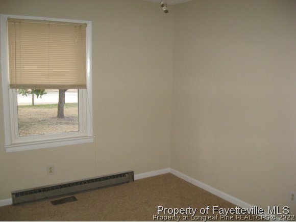 225 Cecil Avenue Spring Lake, NC 28390 - Photo 12 of 24 an empty room with a window