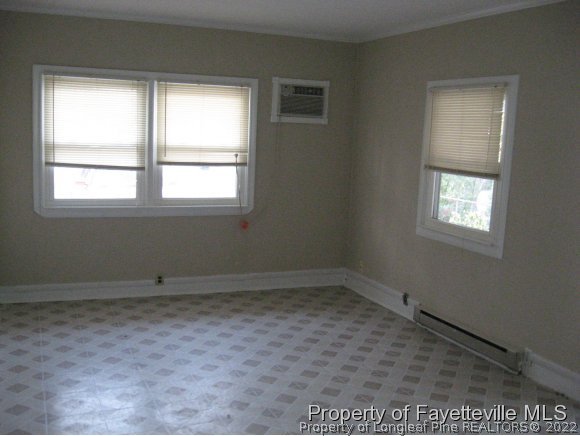 225 Cecil Avenue Spring Lake, NC 28390 - Photo 16 of 24 an empty room with a window