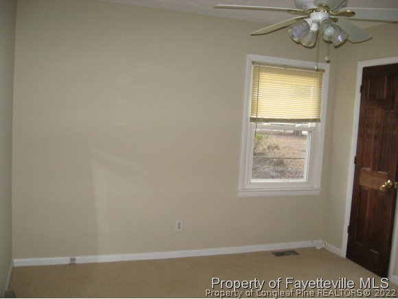225 Cecil Avenue Spring Lake, NC 28390 - Photo 8 of 24 an empty room with windows