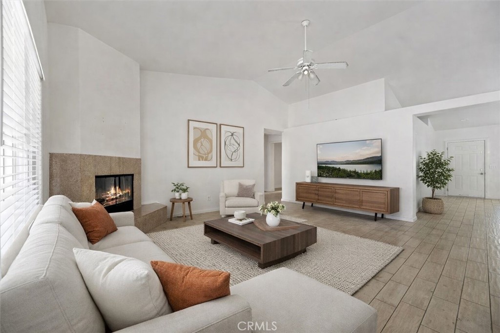 66034 Santa Rosa Road Desert Hot Springs, CA 92240 - Photo 1 of 1 a living room with furniture and a fireplace