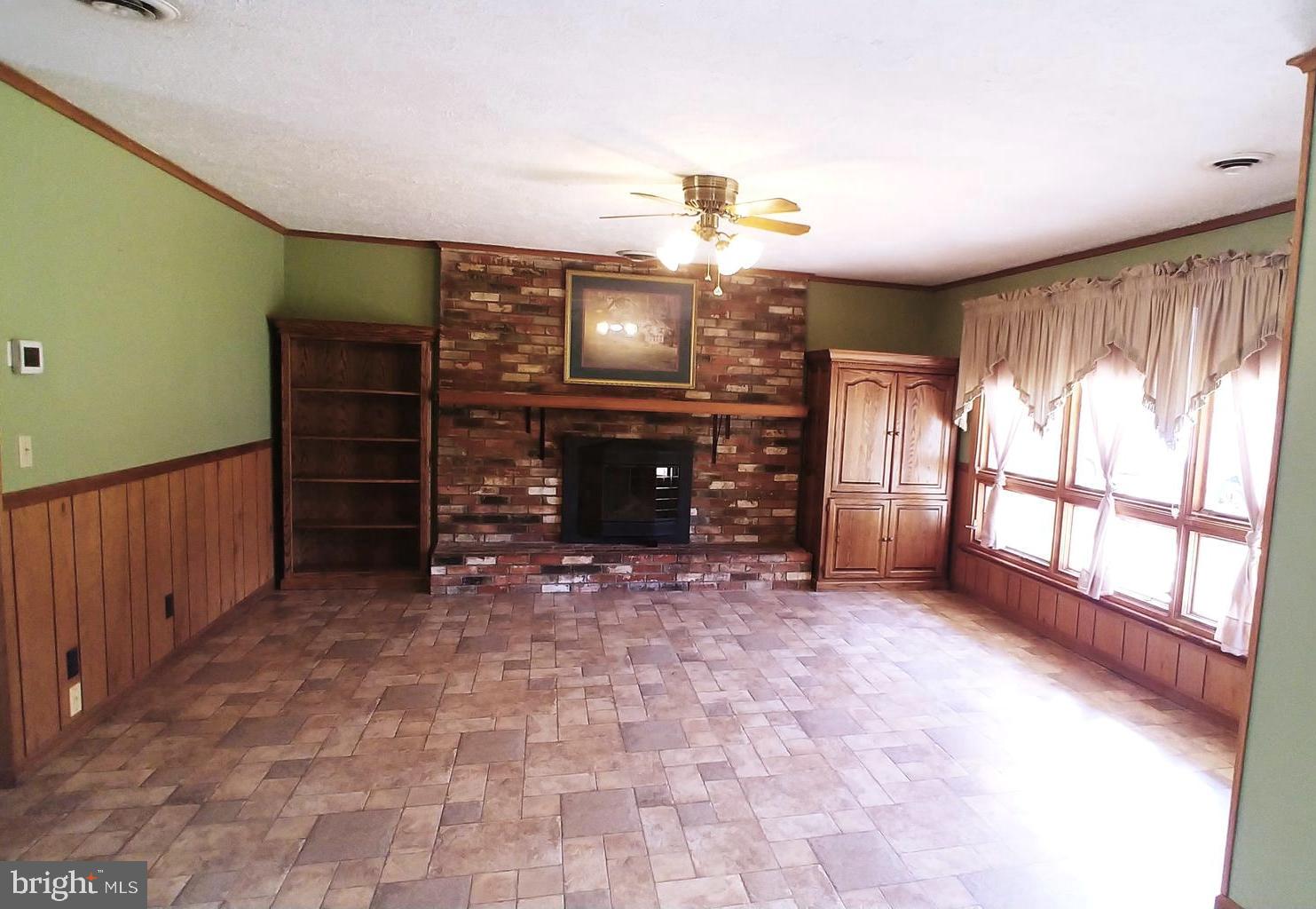28484 Raccoon Ford Road Burr Hill, VA 22433 - Photo 11 of 48 Living Room has custom made cabinets convey