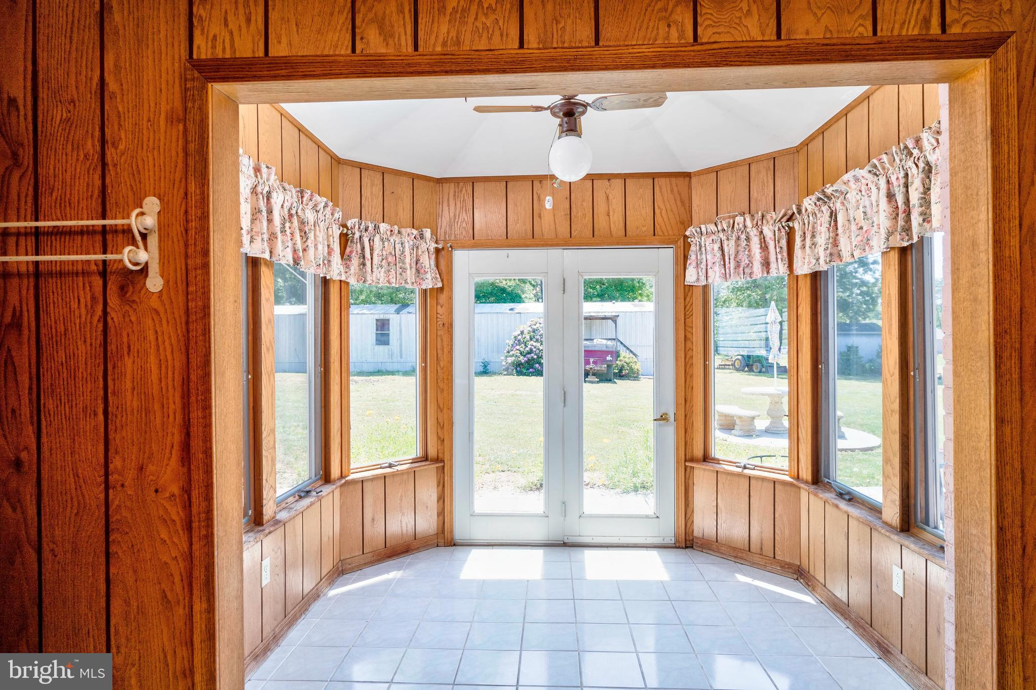 28484 Raccoon Ford Road Burr Hill, VA 22433 - Photo 14 of 48 Adorable Sunroom overlooks patio and backyard