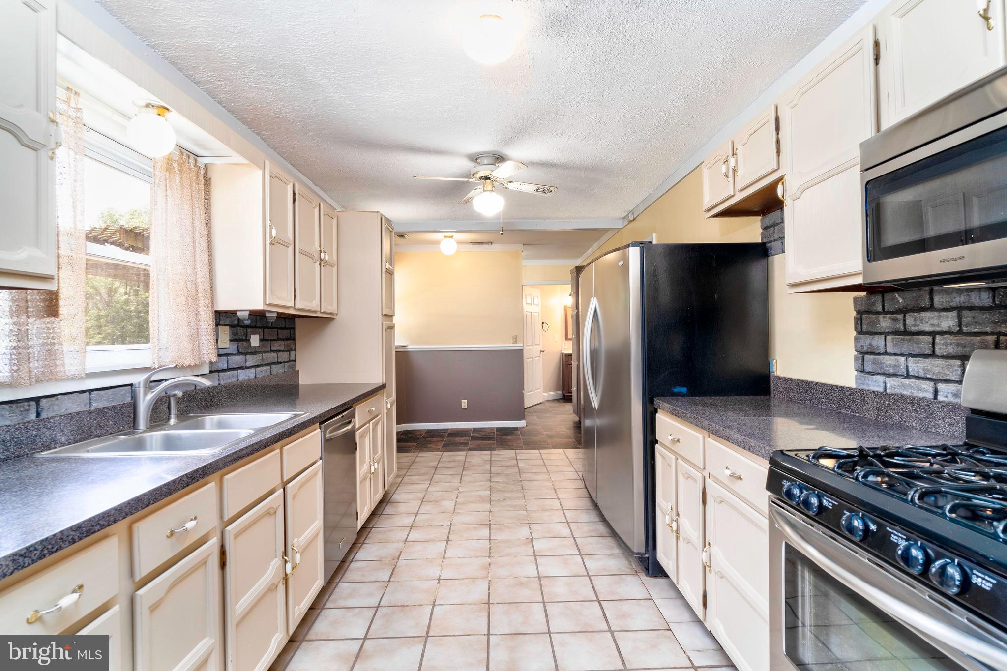28484 Raccoon Ford Road Burr Hill, VA 22433 - Photo 17 of 48 Kitchen looking toward breakfast & laundry