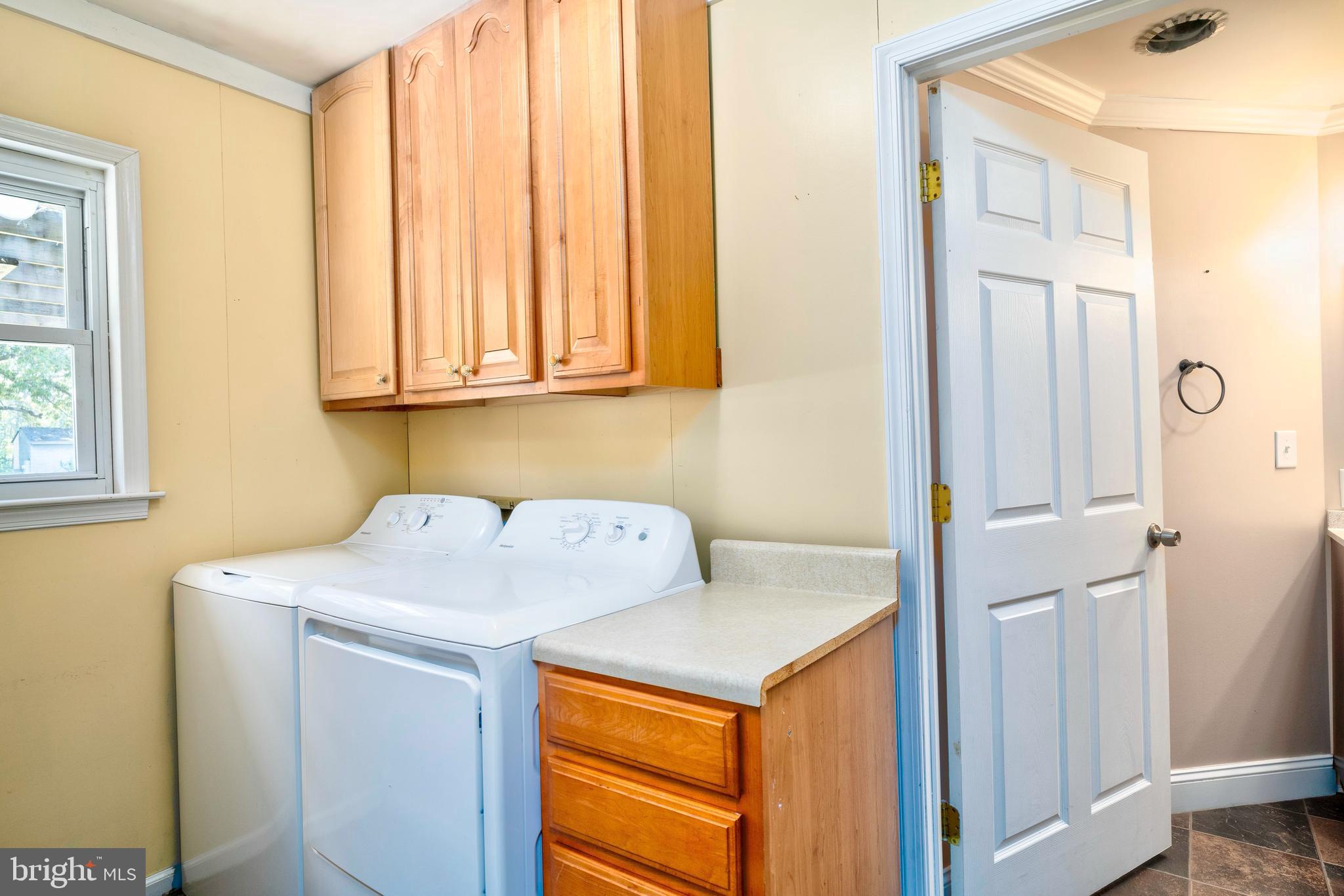 28484 Raccoon Ford Road Burr Hill, VA 22433 - Photo 20 of 48 Laundry room with cabinets-full bath beyond it