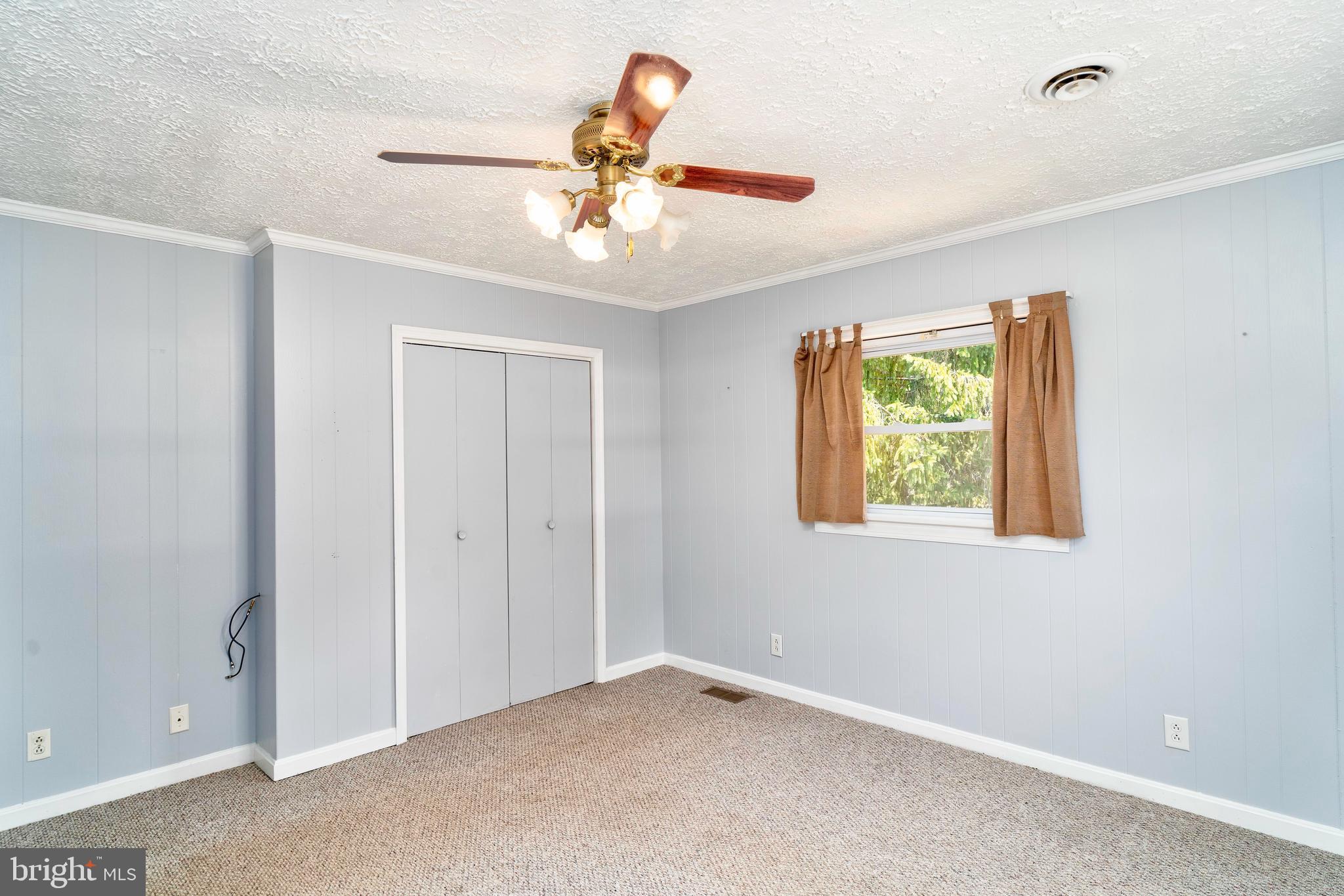 28484 Raccoon Ford Road Burr Hill, VA 22433 - Photo 30 of 48 Good size closet, ceiling fan, main bedroom