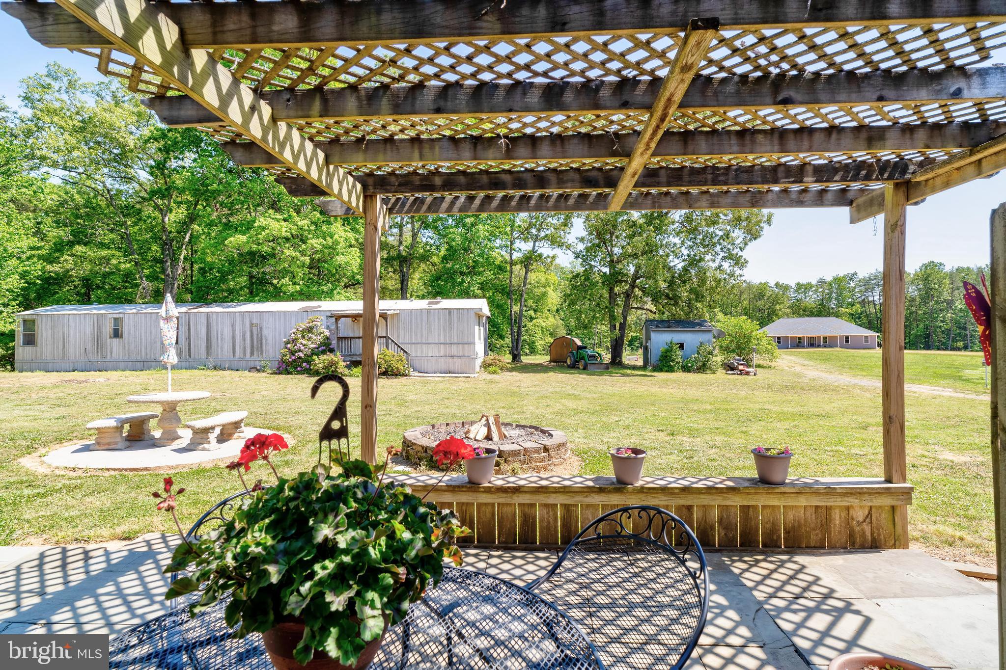 28484 Raccoon Ford Road Burr Hill, VA 22433 - Photo 45 of 48 Current view off pergola, in processs of clean up.
