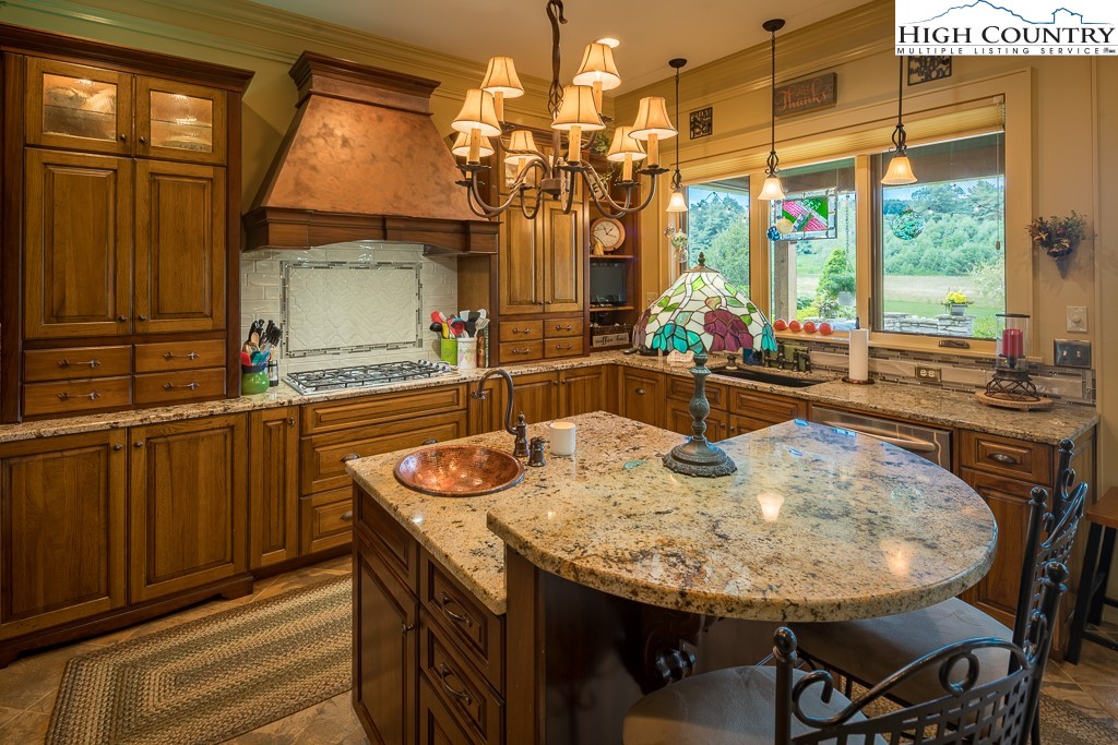 800 Turtle Creek Drive, Unit 4B Boone, NC 28607 - Photo 16 of 45 a dining table with chairs and window