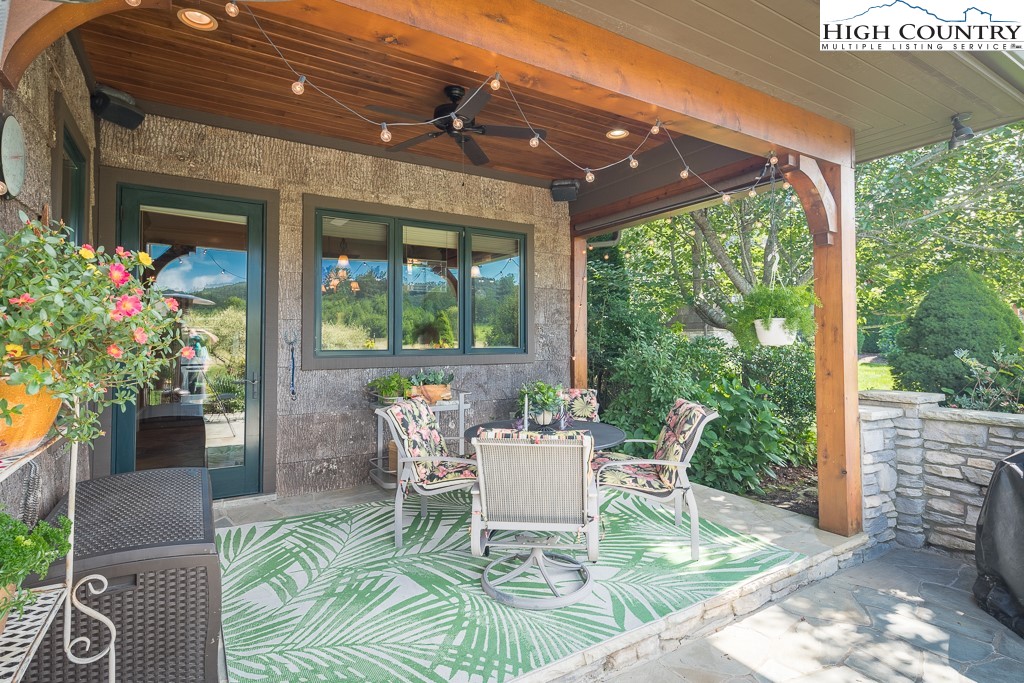 800 Turtle Creek Drive, Unit 4B Boone, NC 28607 - Photo 20 of 45 a patio with yard glass top table and chairs
