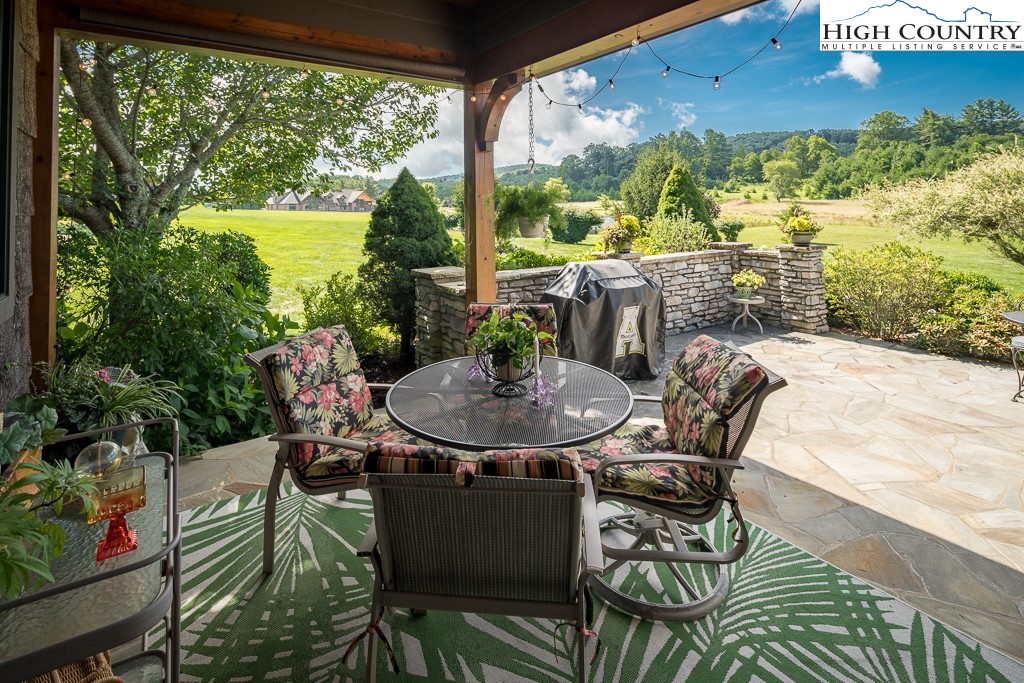 800 Turtle Creek Drive, Unit 4B Boone, NC 28607 - Photo 21 of 45 a view of a patio with table and chairs and potted plants