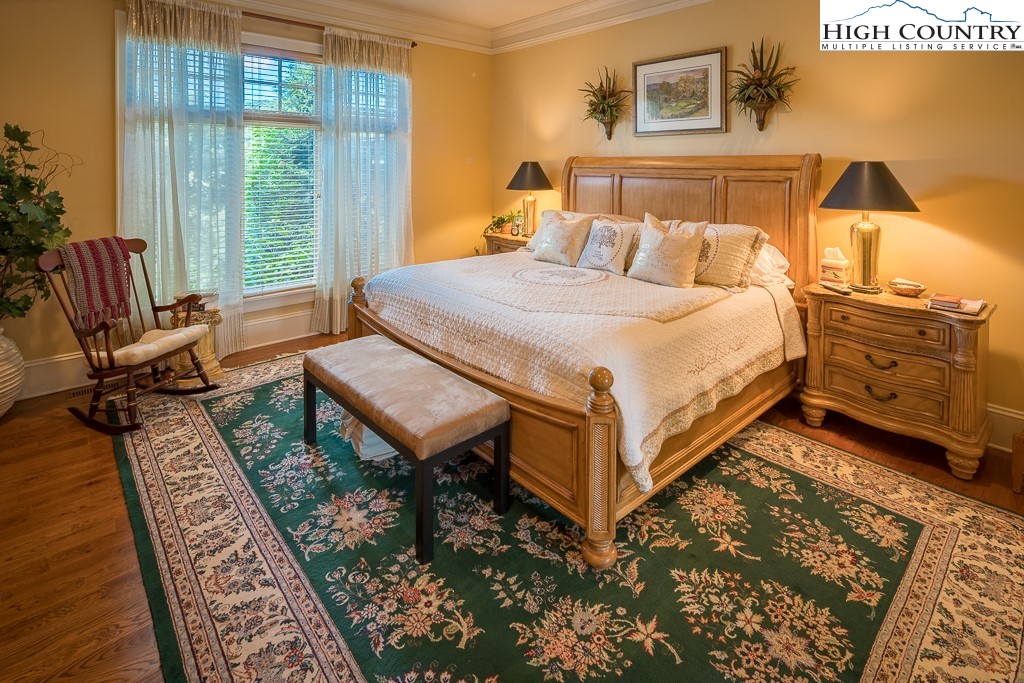 800 Turtle Creek Drive, Unit 4B Boone, NC 28607 - Photo 23 of 45 a bedroom with a bed and wooden floor