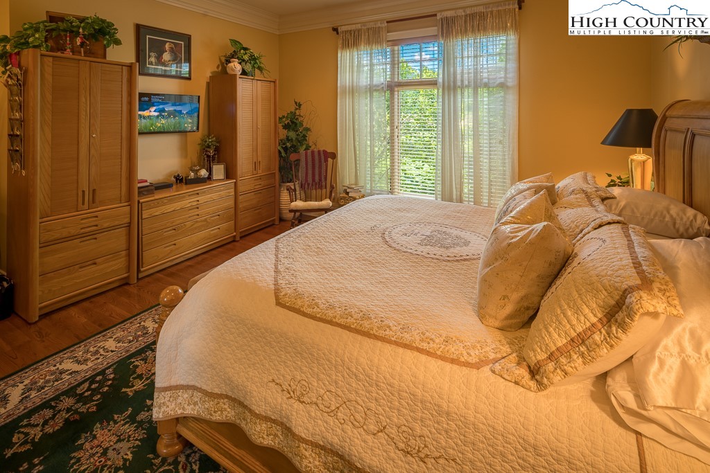 800 Turtle Creek Drive, Unit 4B Boone, NC 28607 - Photo 24 of 45 a bedroom with a bed and a dresser