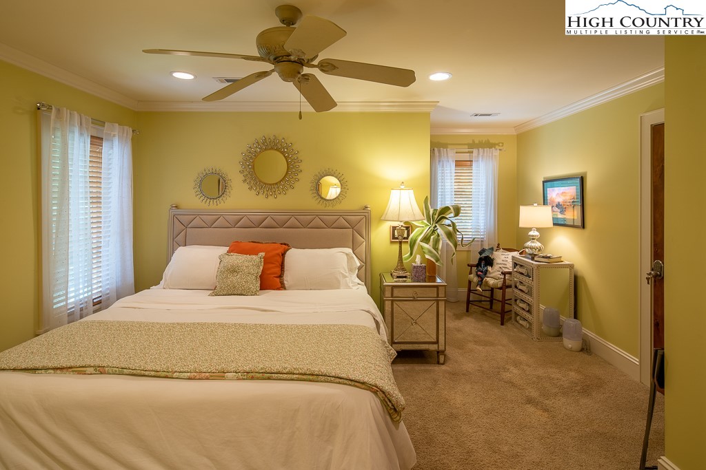 800 Turtle Creek Drive, Unit 4B Boone, NC 28607 - Photo 32 of 45 a bedroom with a bed and ceiling fan