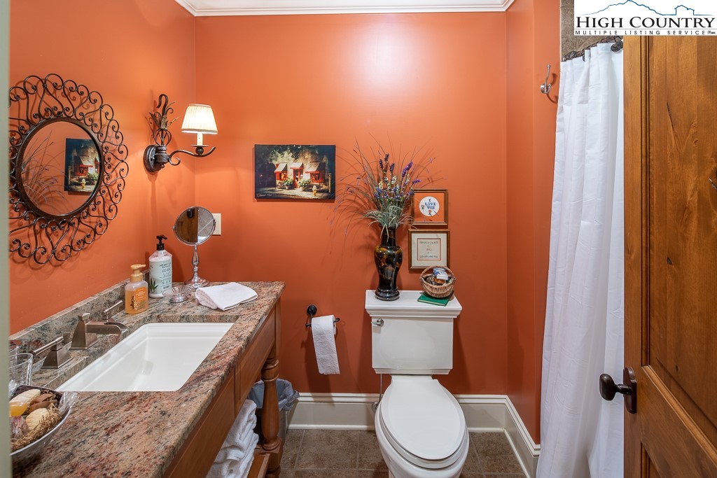 800 Turtle Creek Drive, Unit 4B Boone, NC 28607 - Photo 34 of 45 a bathroom with a toilet a sink and a mirror