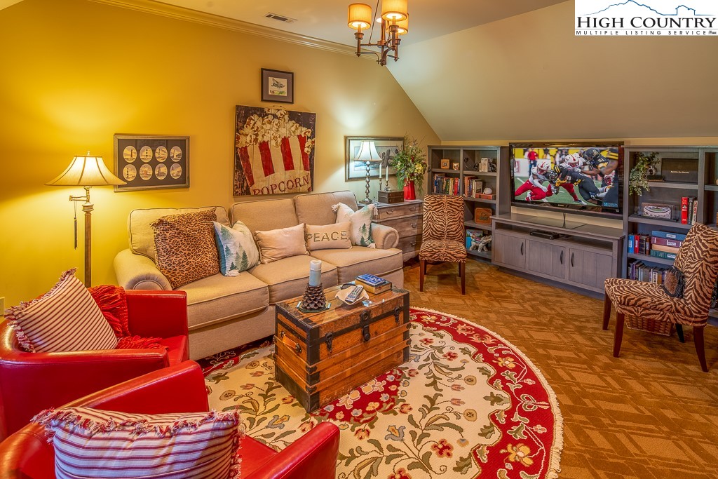 800 Turtle Creek Drive, Unit 4B Boone, NC 28607 - Photo 36 of 45 a living room with furniture and a flat screen tv