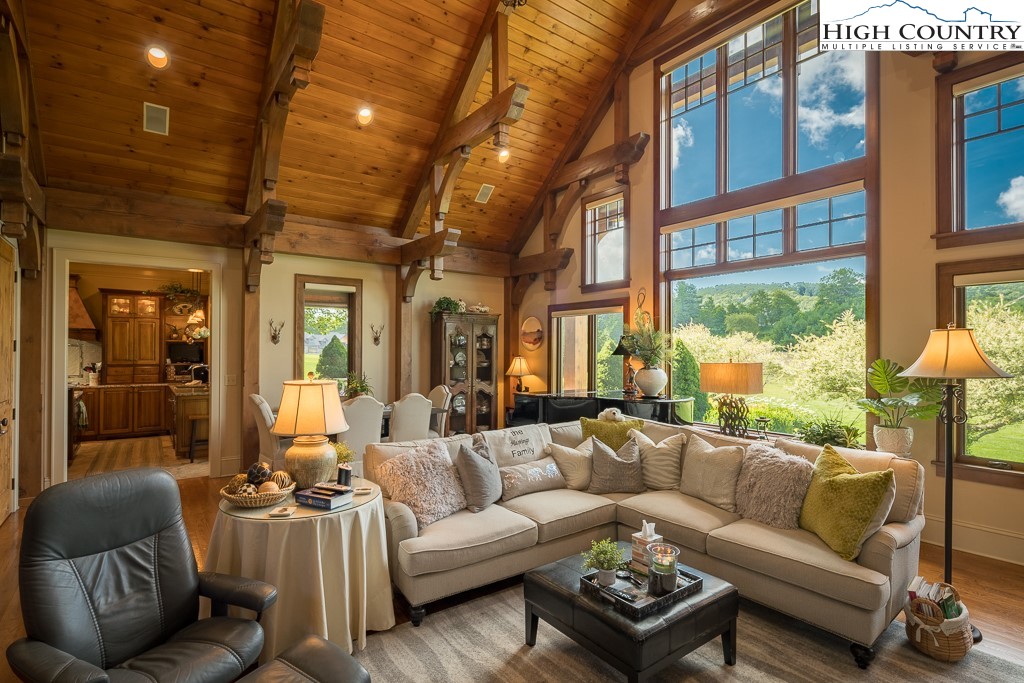 800 Turtle Creek Drive, Unit 4B Boone, NC 28607 - Photo 9 of 45 a living room with furniture a large window and a chandelier