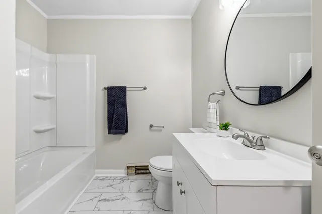 a bathroom with a sink toilet and bathtub