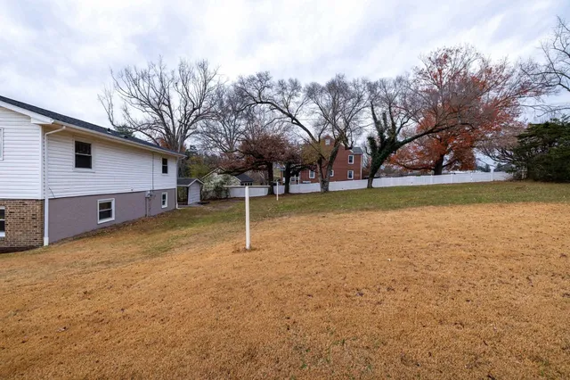 a backyard of a house with lots of green space