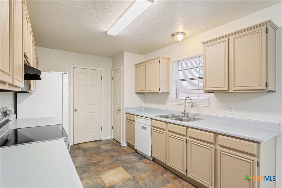 204 Rodeo Circle Copperas Cove, TX 76522 - Photo 13 of 28 a kitchen with a sink and cabinets