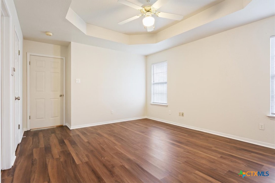 204 Rodeo Circle Copperas Cove, TX 76522 - Photo 16 of 28 an empty room with wooden floor and windows