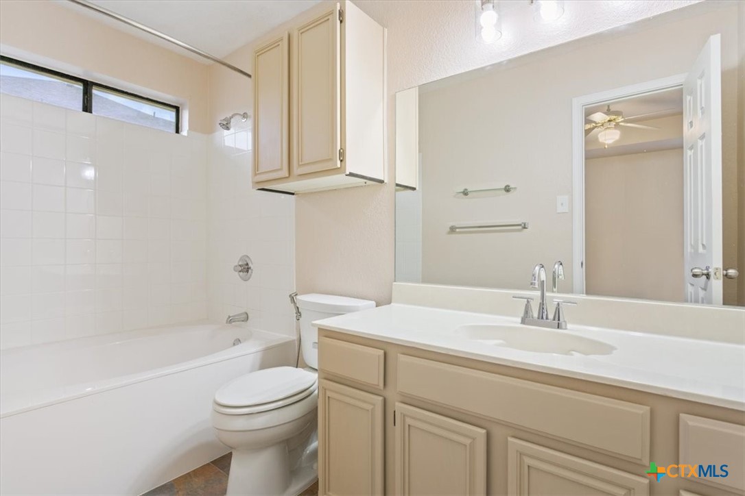 204 Rodeo Circle Copperas Cove, TX 76522 - Photo 19 of 28 a bathroom with a sink a toilet and shower