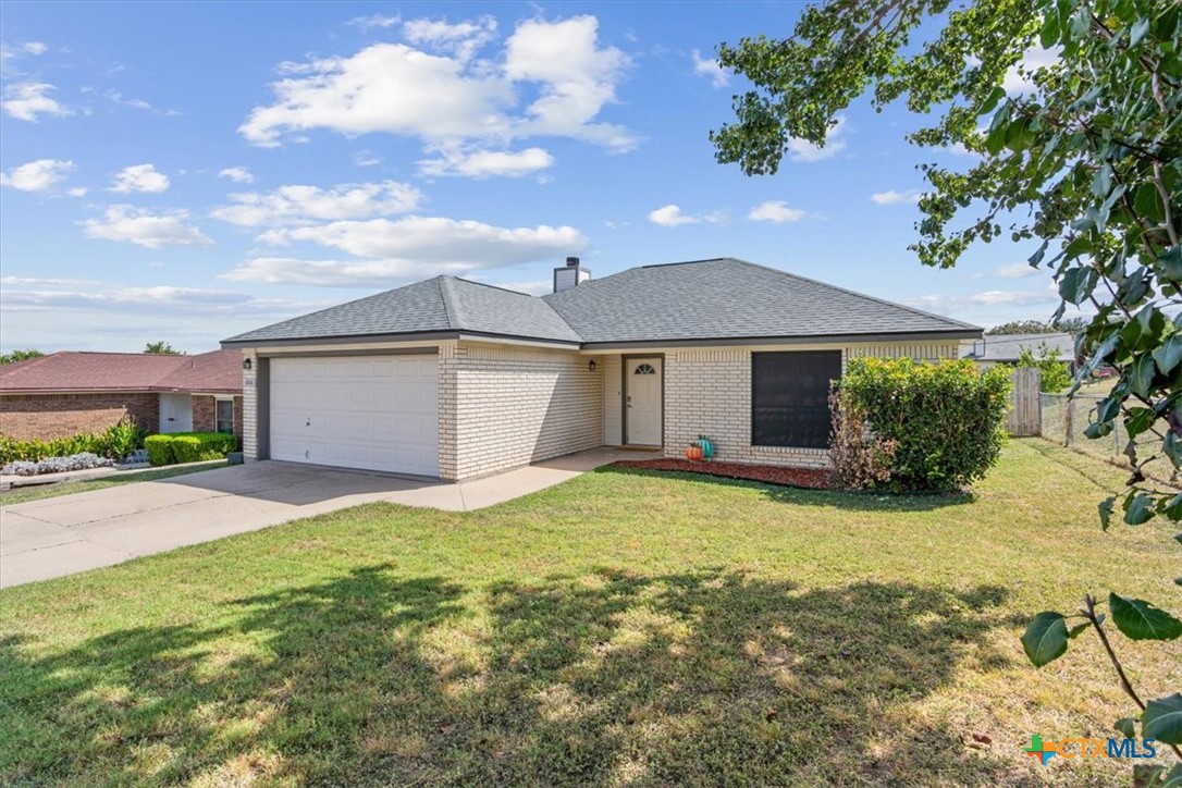 204 Rodeo Circle Copperas Cove, TX 76522 - Photo 2 of 28 a yellow house with trees in front of it