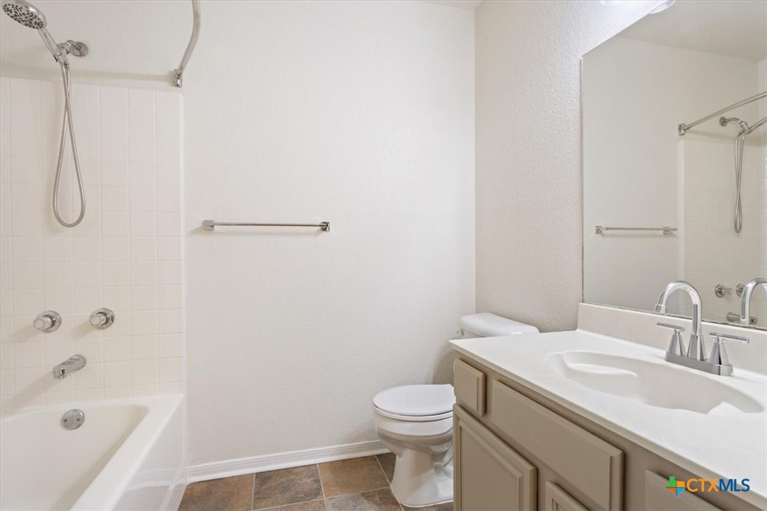 204 Rodeo Circle Copperas Cove, TX 76522 - Photo 25 of 28 a bathroom with a sink a toilet and shower