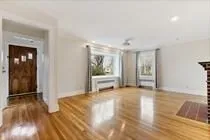 a view of an empty room and glass door