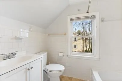 a bathroom with a sink toilet and mirror