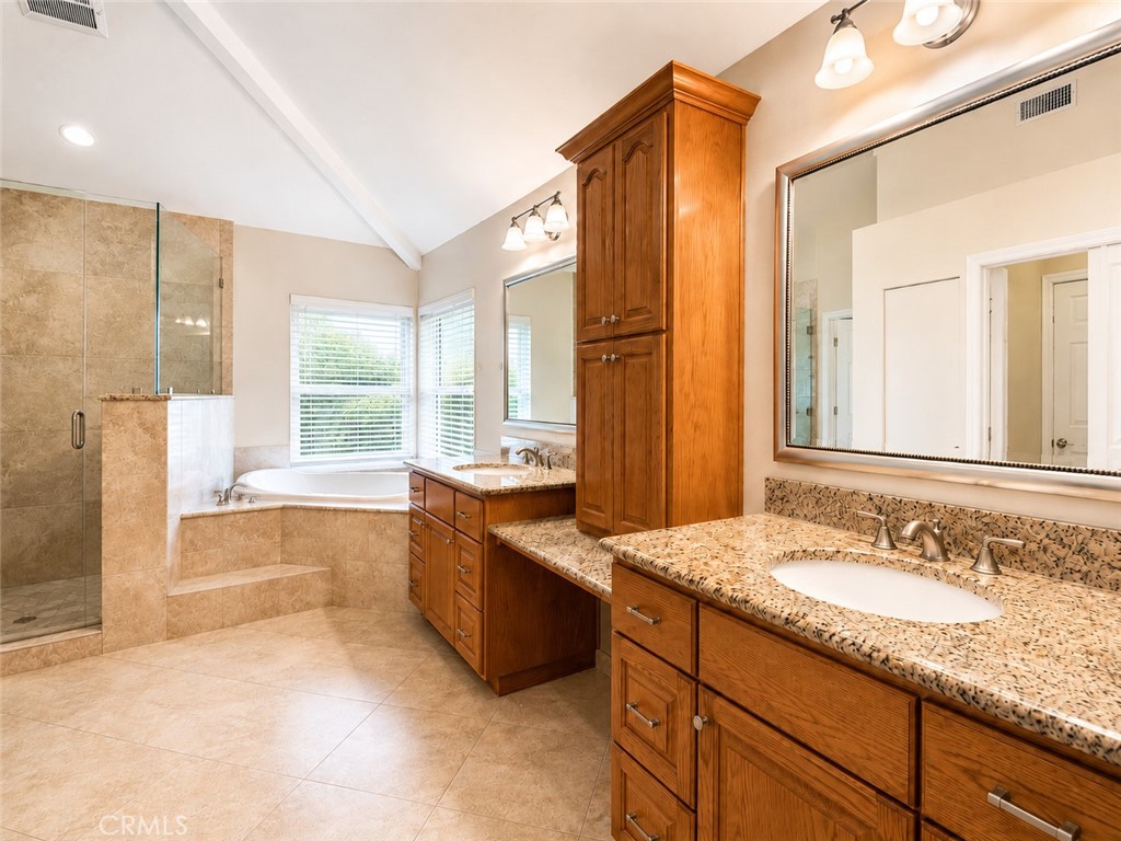 2811 North Roxbury Street Orange, CA 92867 - Photo 12 of 22 a spacious bathroom with a granite countertop tub sink and mirror