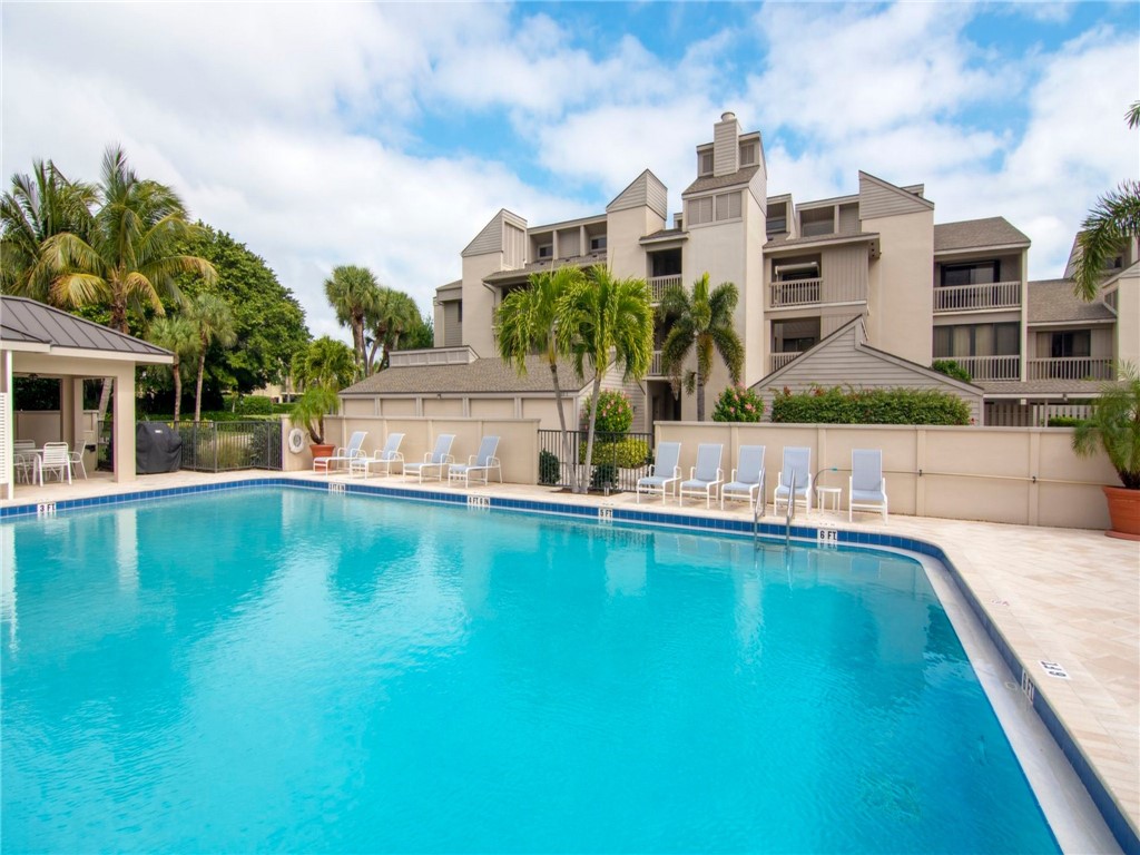 1880 Bay Road, Unit I319 Vero Beach, FL 32963 - Photo 26 of 36 a view of building with outdoor space and swimming pool