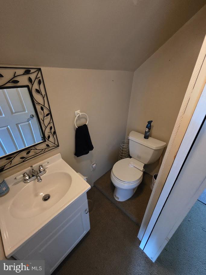 4903 Erie Road Harrisburg, PA 17111 - Photo 22 of 33 a bathroom with a sink mirror and toilet