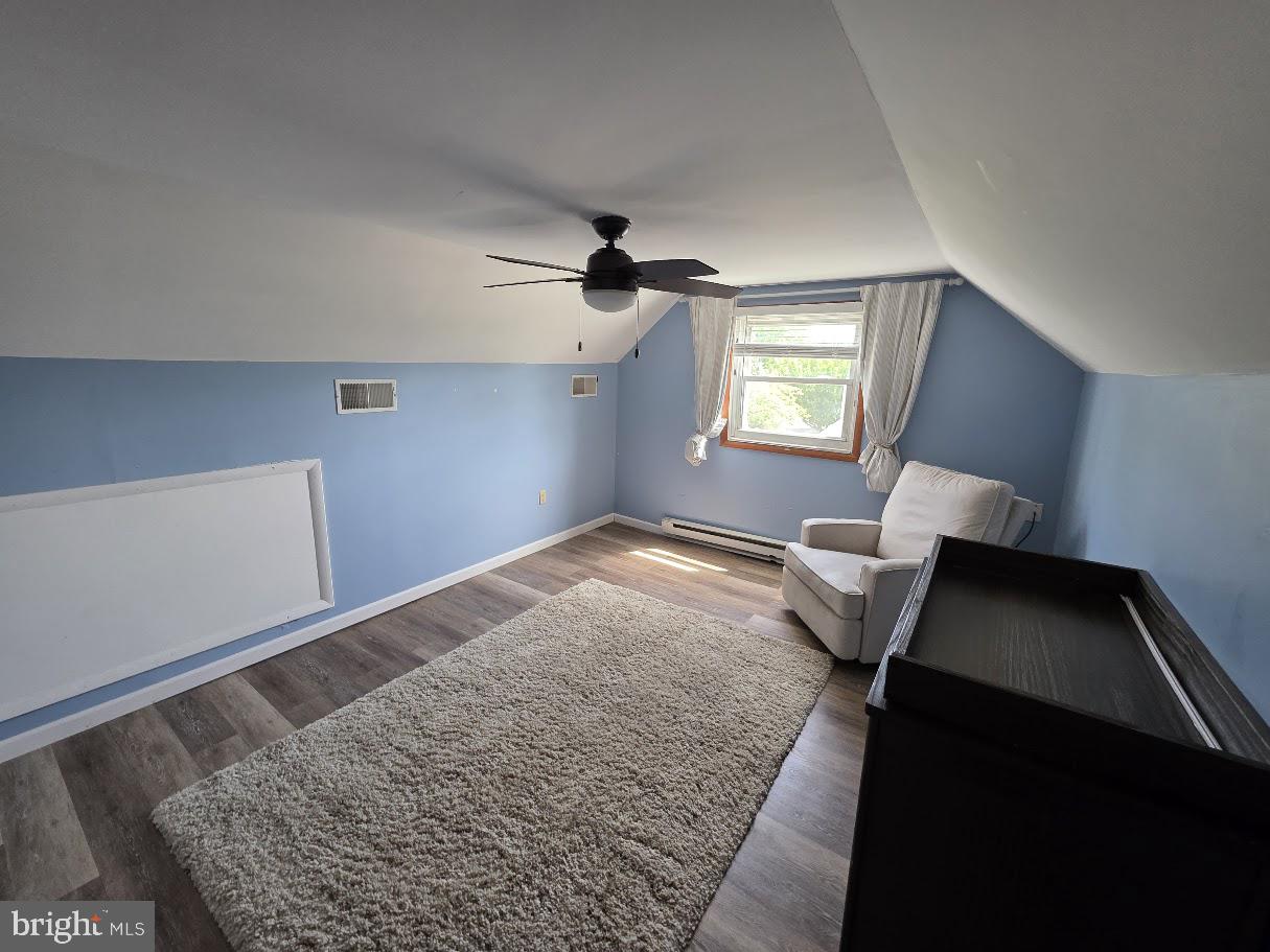 4903 Erie Road Harrisburg, PA 17111 - Photo 23 of 33 a bedroom with a bed and a lamp on table