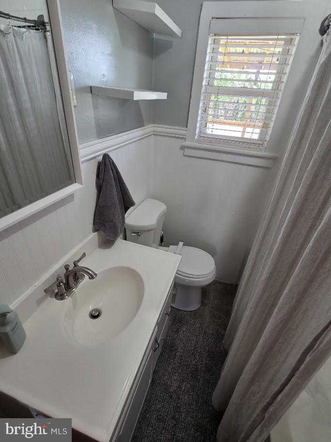 4903 Erie Road Harrisburg, PA 17111 - Photo 8 of 33 a bathroom with a sink and a toilet