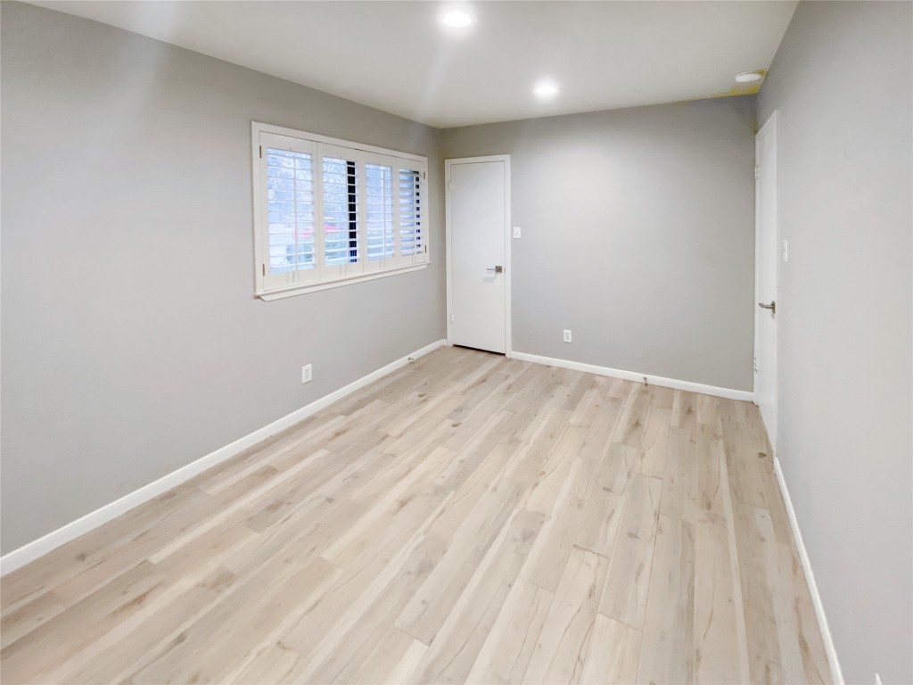 1503 Roundup Trail Round Rock, TX 78681 - Photo 12 of 23 Spare room with light wood-style flooring and recessed lighting