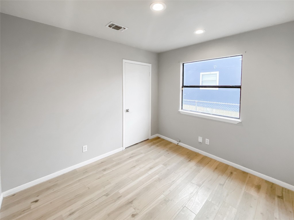 1503 Roundup Trail Round Rock, TX 78681 - Photo 13 of 23 Spare room with light wood-style flooring and recessed lighting
