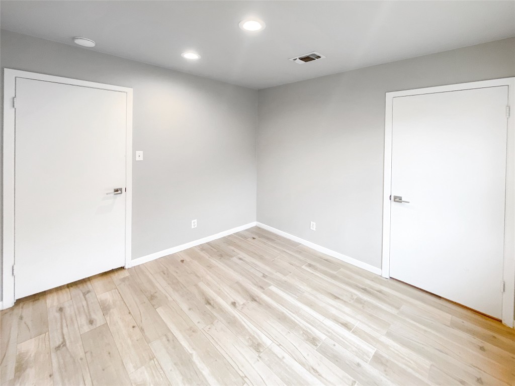 1503 Roundup Trail Round Rock, TX 78681 - Photo 14 of 23 Unfurnished room featuring light wood-type flooring and recessed lighting