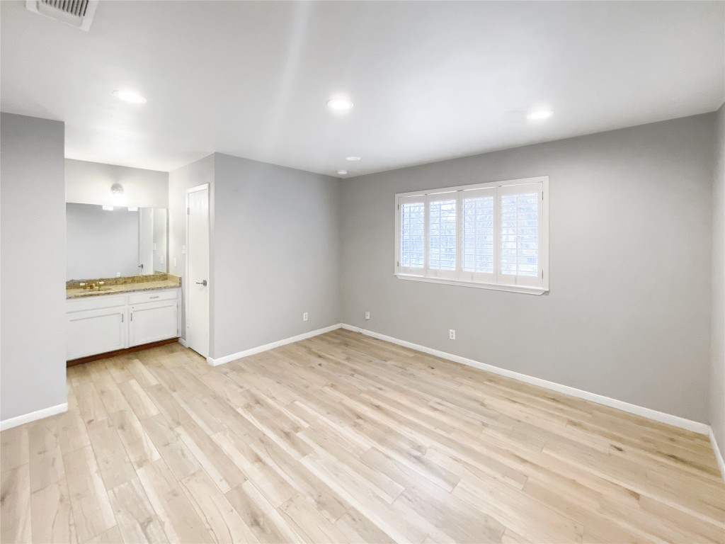 1503 Roundup Trail Round Rock, TX 78681 - Photo 16 of 23 Unfurnished bedroom with recessed lighting and light wood finished floors