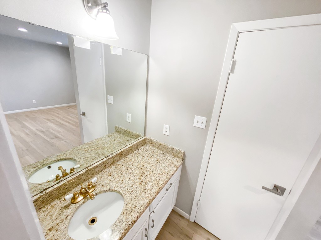 1503 Roundup Trail Round Rock, TX 78681 - Photo 17 of 23 Bathroom with light wood-style floors, vanity, and recessed lighting