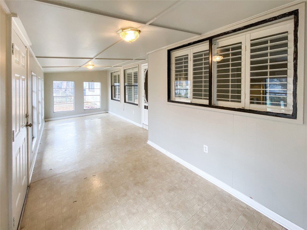 1503 Roundup Trail Round Rock, TX 78681 - Photo 20 of 23 Unfurnished sunroom with baseboards and french doors