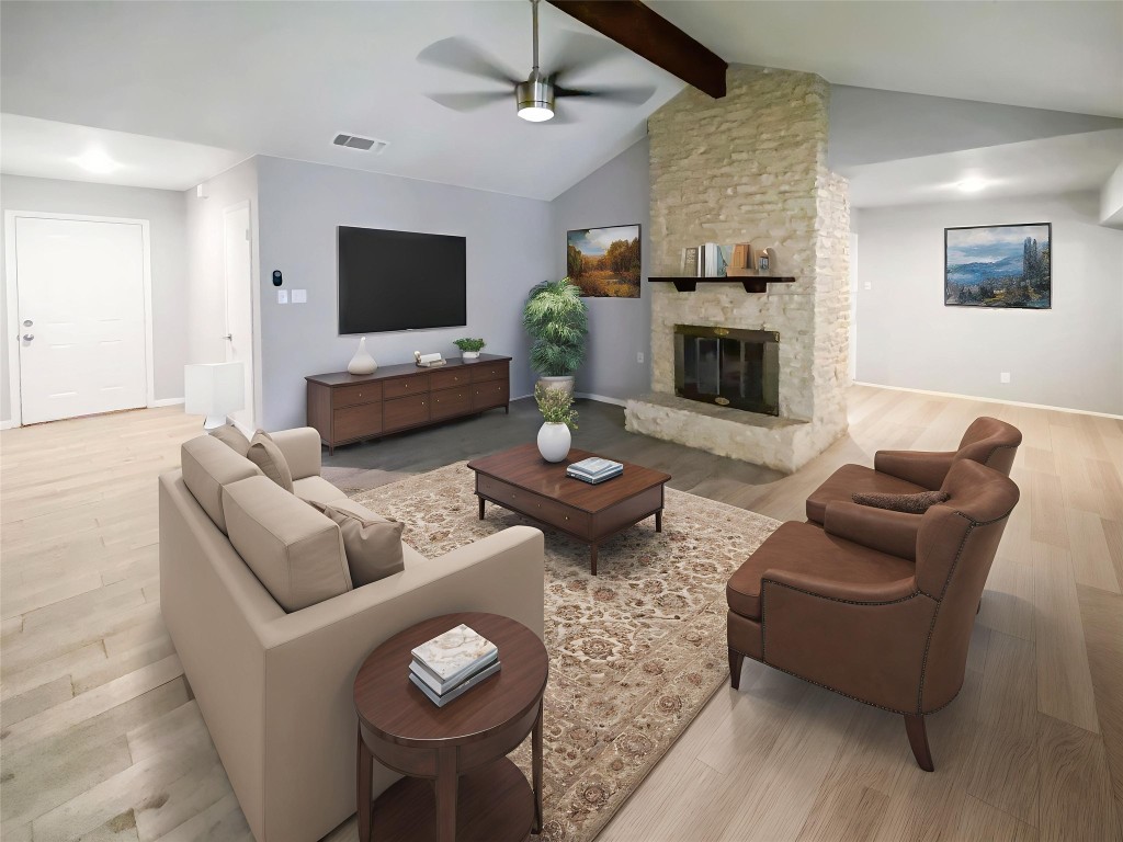 1503 Roundup Trail Round Rock, TX 78681 - Photo 2 of 23 Living room with light wood finished floors, ceiling fan, and a fireplace