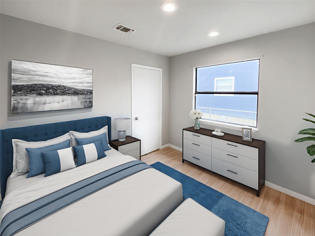 1503 Roundup Trail Round Rock, TX 78681 - Photo 3 of 23 Bedroom featuring light wood-style flooring and recessed lighting