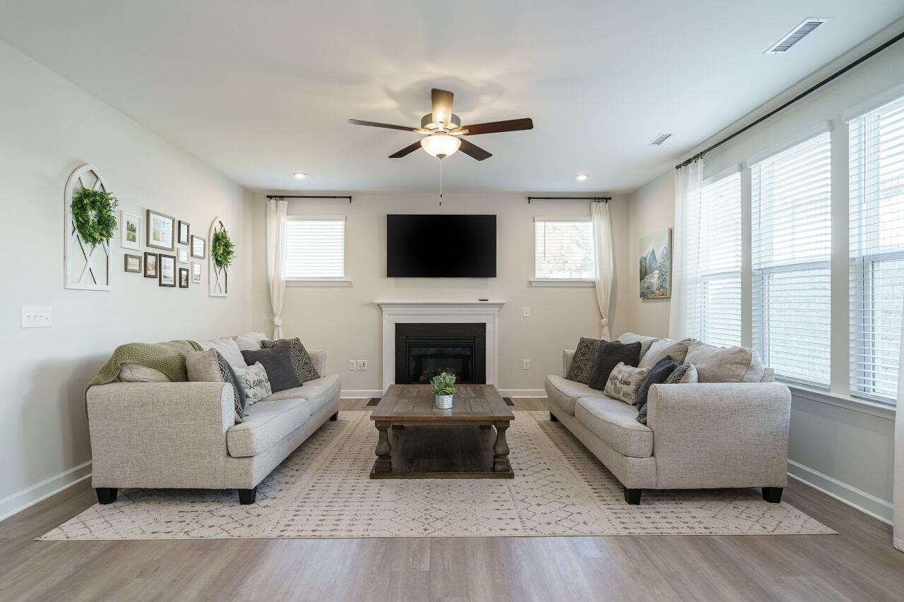 62 Maximus Circle Garner, NC 27529 - Photo 11 of 30 a living room with furniture a fireplace and a flat screen tv
