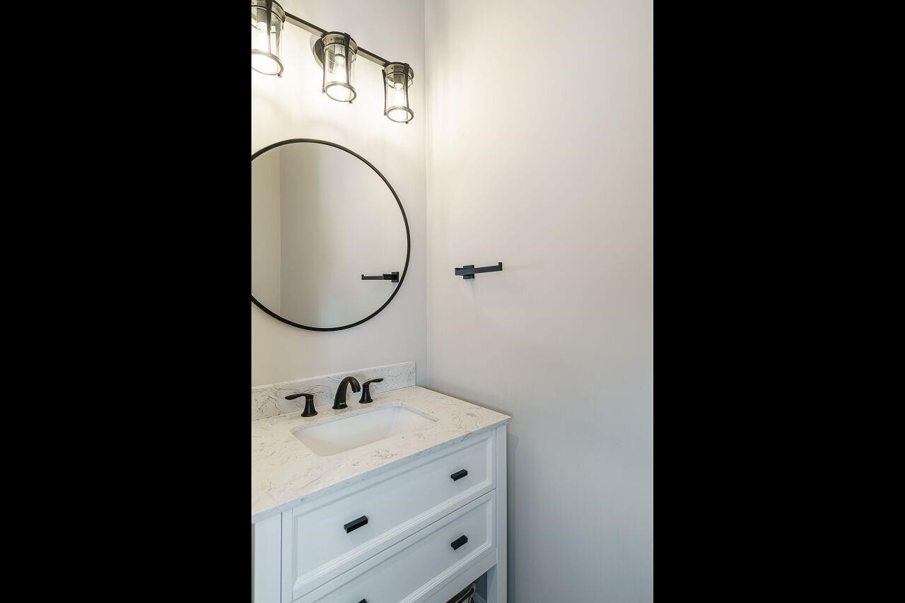 62 Maximus Circle Garner, NC 27529 - Photo 17 of 30 a bathroom with a sink and a mirror