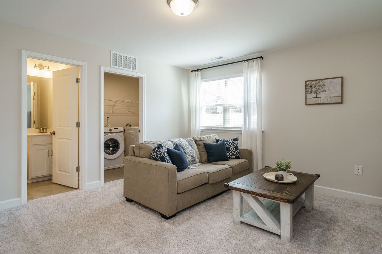 62 Maximus Circle Garner, NC 27529 - Photo 19 of 30 a living room with furniture and a window