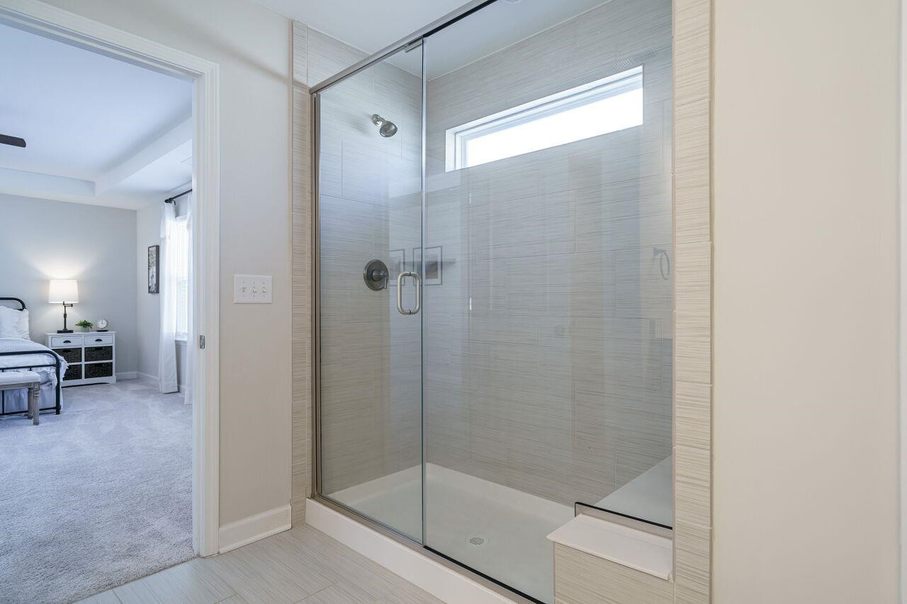 62 Maximus Circle Garner, NC 27529 - Photo 24 of 30 a bathroom with a glass shower door